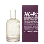 A bottle of Malin + Goetz Moroccan Fig Eau de Parfum next to its dark purple packaging box, on a clean white background.